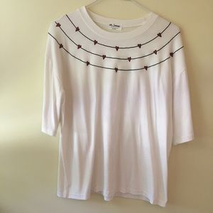 white t-shirt with red hearts